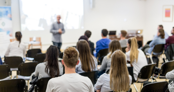 A professor giving a lecture to his students